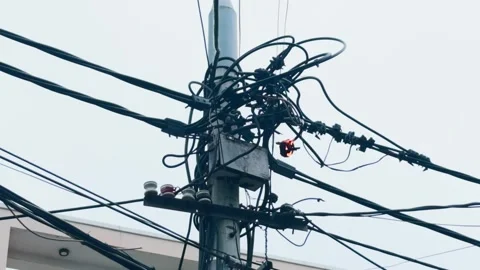 Power lines short circuiting, sparking, and burning on an electrical pole, Stock Footage 335644353