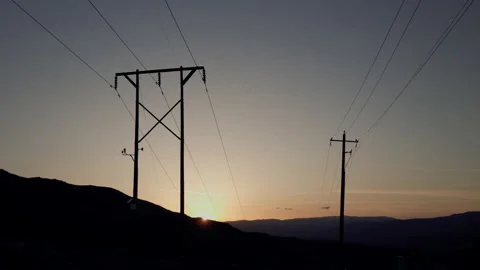 Power lines silhouetted in the sunset over the Reno Tahoe area Stock Footage 202292059