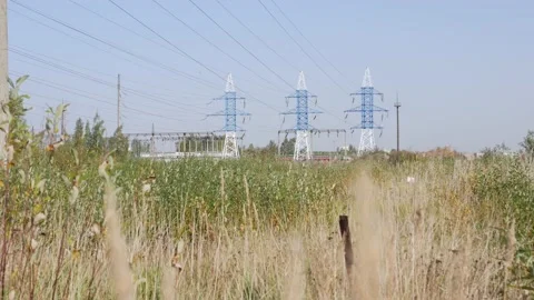 Power lines on the sky background. Power line towers in countryside. Concept of Video stock 141307023