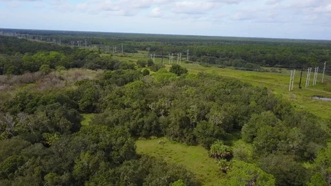 Power Lines from Solar power Field approach Stock Footage 98570355