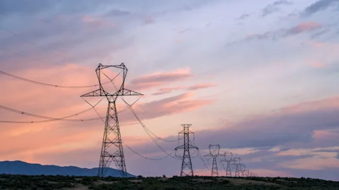Power lines spanning over the desert Utah landscape at sunset Stock Footage 154315064