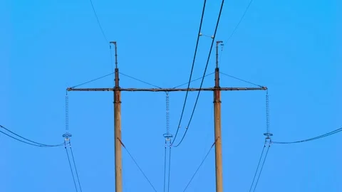Power Lines Stretching Out Beneath a Vast, Clear Blue Sky with Absolutely No Stock Footage 311281913