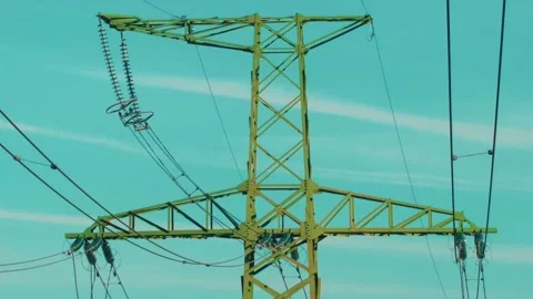 Power lines with sun rays on blue sky. H... | Stock Video | Pond5