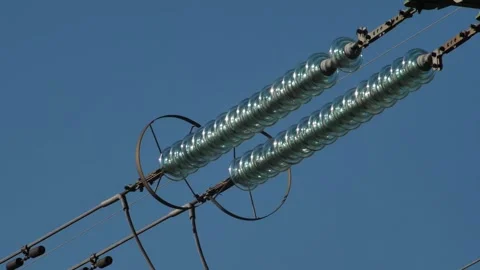 Power lines with sun rays on blue sky. H... | Stock Video | Pond5