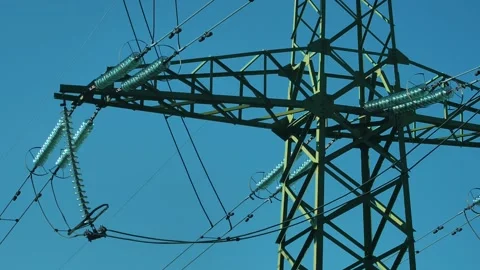 Power lines with sun rays on blue sky. H... | Stock Video | Pond5