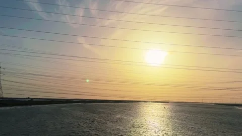 Power Lines at Sunset Over Water in Rann of Kutch Gujarat India Stock Footage 331800768