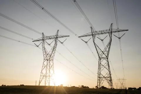 Power lines at sunset Stock Photos