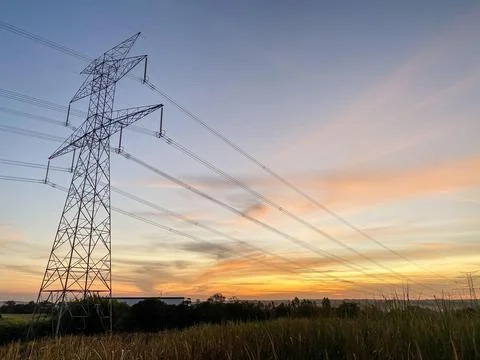 Power lines at sunset Stock Photos