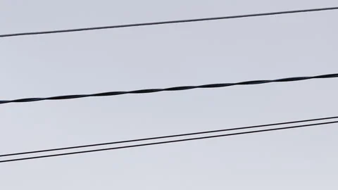 Power lines sway due to heavy ice and hurricane Stock Footage 175948604