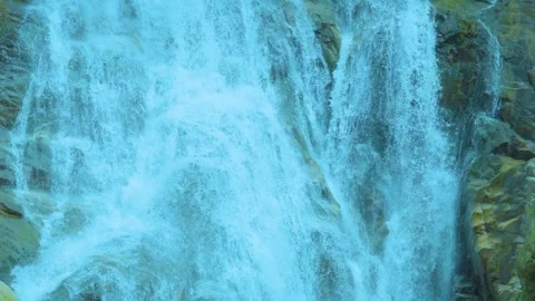 The Power of Nature: A Close-Up of a Rushing Waterfall Stock Footage 282081673