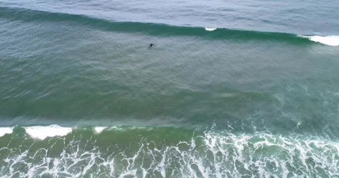 The Power of the Ocean and the Courage of a Surfer Stock-Footage 324821061