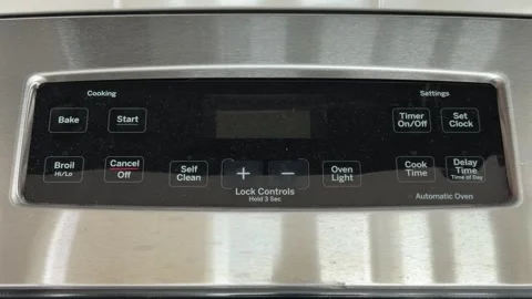 Power outage clock blinking reset on a range Stock-Footage 343325061