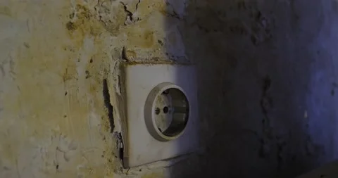 Power outlet on the wall destroyed by moisture. Stock Footage 164874823