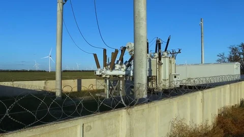 Power plant against the background of wind turbines Stock Footage 80294826