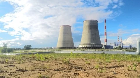 Power plant and white clouds on a summer day timelapse Stock Footage 82984980