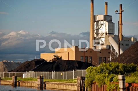 Power plant with coal pile Stock Photos