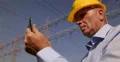 Power Plant Infrastructure Engineer Man Use Digital Tablet Check Electric Cables 4k or 4k+ Resolution
