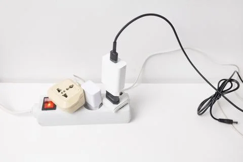 Power plug and socket on a white background. Stock Photos