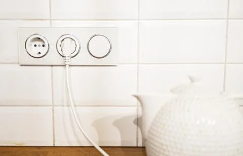 Power plug and socket on a white background. Stock Photos