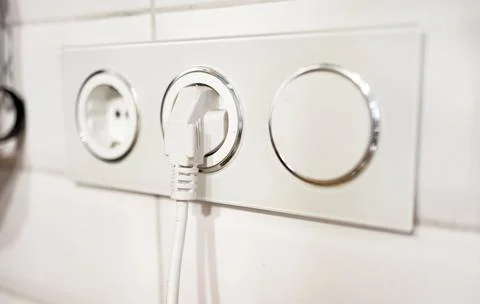 Power plug and socket on a white background. Stock Photos