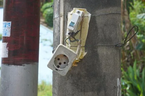 The power plug is broken on the electric pole Stock Photos