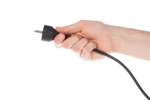Power plug in a hand Stock Photos
