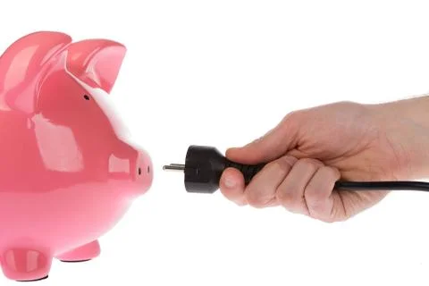 Power plug in a hand Stock Photos