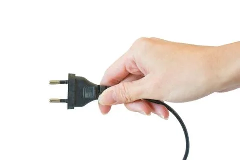 Power plug in a hand on a white background Foto stock