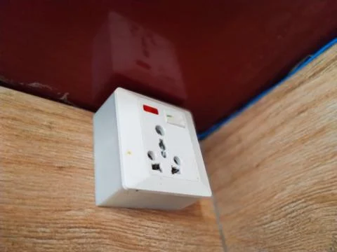 Power plug in the wall mounted Stock Photos