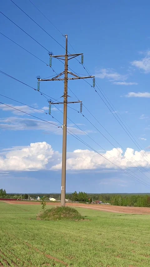 Power pole and electric power lines on spring day Stock-Footage 241784509