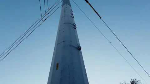 Power pole close up ground to sky daytime Video stock 227343547