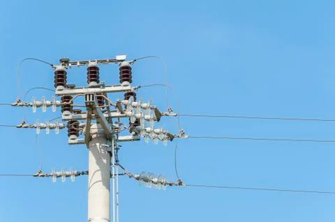 Power pole with external electric separator on top Foto stock