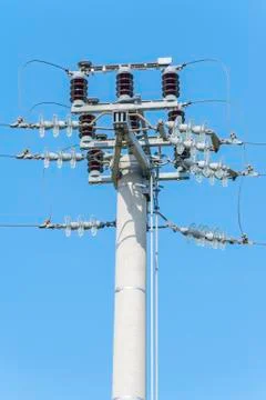 Power pole with external electric separator on top Stock Photos