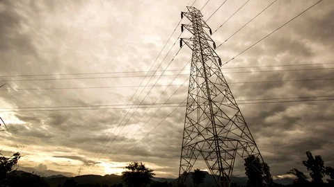 Power pole in sunset with nice clouds and a red sky. Video footage in 4K resolut Stock Footage 78727683