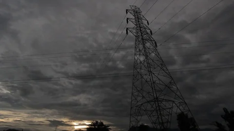 Power pole in sunset with nice clouds and a red sky. Video footage Stock Footage 80079712