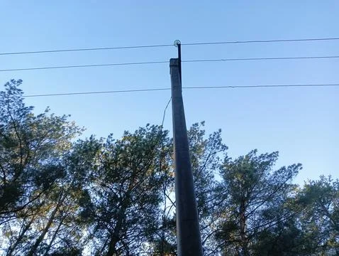 Power pole. Top of an old electrical pole with plugs and wires on a sky bac.. Stock Photos