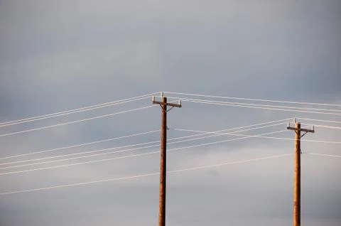 Power pole under cloudy sky Stock Photos
