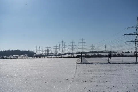Power pole in winter landscape Stock Photos