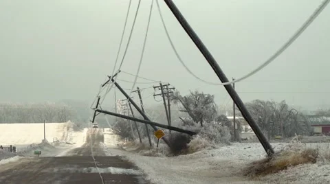 Power poles bent over in ice storm Stock-Footage 59685393
