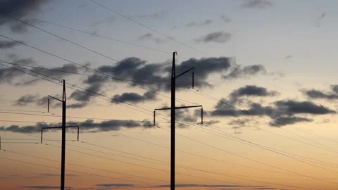 Power poles, electric power lines and clouds in the evening. Stock-Footage 251994989