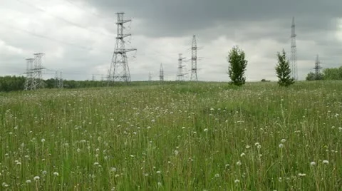 Power pylons on field Stock Footage 11086118
