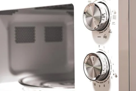 Power regulator, temperature control. Microwave Oven. Close-up. Stock Photos