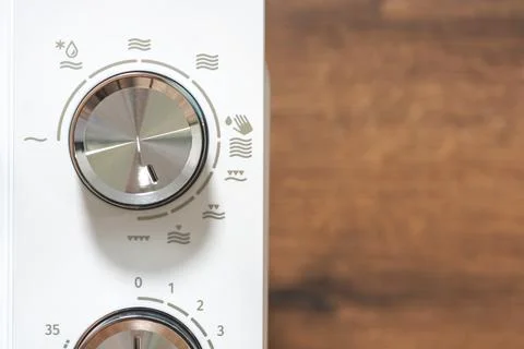Power regulator, temperature control. Microwave Oven. Close-up. Stock Photos