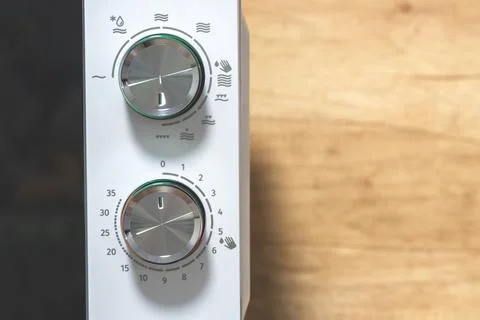 Power regulator, temperature control. Microwave Oven. Close-up. Stock Photos