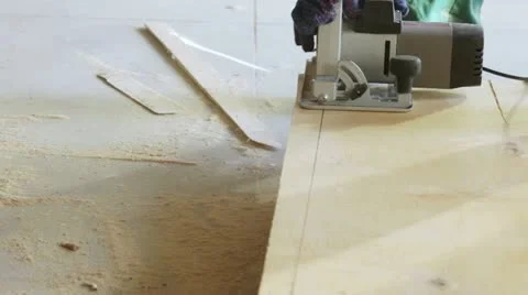 Power saw cutting wood stove. Stock Footage