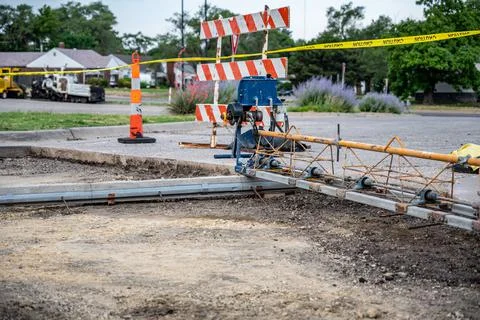 Power screed setup and ready for pouring concrete on prepared subbase of a road Stock Photos