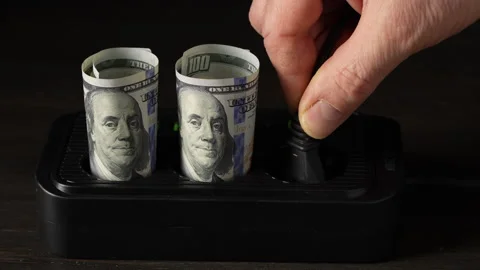 Power socket with american dollar banknotes. Concept of electricity bill Stock Footage 306318278
