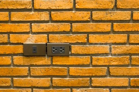 Power socket and lan socket on brick wall Foto stock