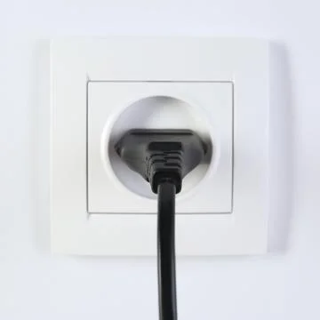 Power socket and plug on white background. Electrician's equipment Stock Photos