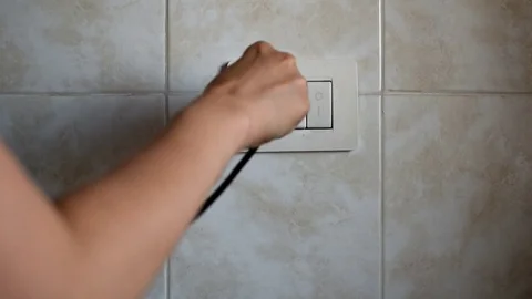 Power socket hand switch Stock Footage 76928625